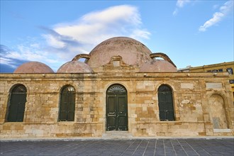 Venetian old town, Venetian harbour, mosque, facade, green door, green windows, blue sky with white