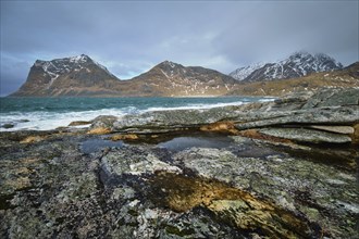 Rocky coast of fjord of Norwegian sea in winter. Lofoten islands, Norway, Europe