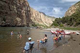 Dinosaur, Colorado, River rafters on the Green River in Dinosaur National Monument relax in the