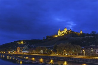 View of Marienberg Fortress from Alte Mainbrucke (old bridge) in evening, Wurzburg, Germany, Europe