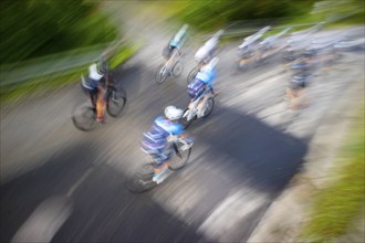 Photo with blur on a competitive road bike race