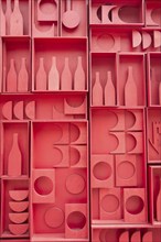 Stylized representation of a small cellar of wine bottles