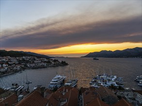 Evening atmosphere at sunset by the sea, view from the bell tower, Korcula harbour, Korcula island,