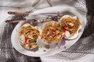 First dish with spaghetti integral to scallops and parsley