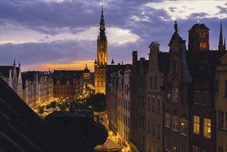 Beautiful old town in Gdansk at summer dusk Poland. Sunset night view from the window rooftop on