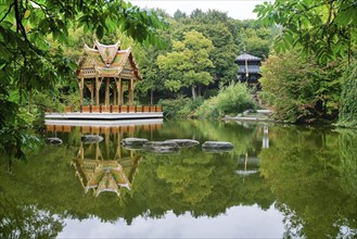 Thai-Sala (Thai room) in Westpark and reflection in water, beauty in nature in Munich. Reflcetions