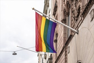 Gay pride rainbow flag hanging on public building