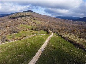 Aerial drone view of the Mountain Range of Rincon in Madrid during autumn Sierra del Rincon in