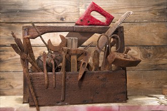 Old wooden box with tools for craftsman carpenter