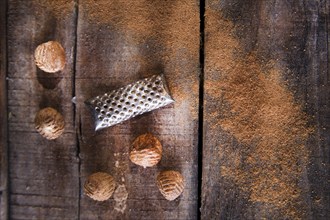 Detail of the grating of nutmeg flavor unique to particular foods and flavors