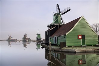 Windmill in the Dutch traditional village Zaanse Schans which is one of the busiest tourist