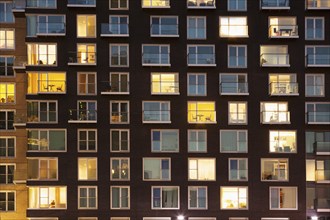 Modern apartment building at dusk