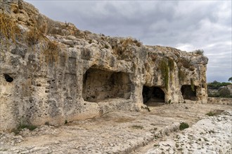 Syracuse, Italy, 28 December, 2023: view of the Caves of Nymphaeum in the Neapolis Archaeological