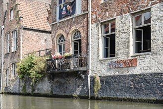 Ghent, Belgium, July 31, 2016: People sitting on a restaurant terrace in Embankment Graslei in the