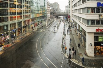 View of Friedrichstrasse in Berlin. In distance station Friedrichstrasse- winter day, people