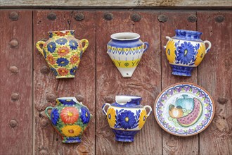 Traditional ceramics on an old wooden gate, damaged, 2nd choice, Frigiliana, Andalusia, Spain,