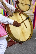 Drummers with colorful musical instruments on the streets of Brazil during a popular festival, Belo