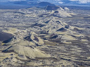 Moss-covered Laki crater or Lakagígar, series of craters, crater continue below glacier