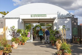 Welcome sign at entrance to Notcutts garden centre, Woodbridge, Suffolk, England, UK