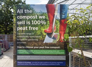 Sign advertising 100% peat free compost, Notcutts garden centre, Woodbridge, Suffolk, England, UK