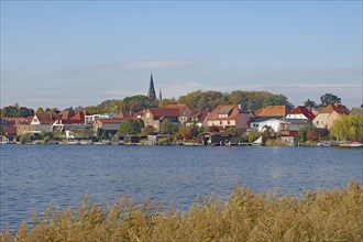 Picturesque town view at the lake with red roofs and nature, island town, Malchow,