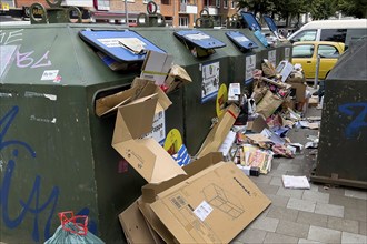 Overflowing paper containers in Hamburg, waste containers, recyclables containers, recyclables,