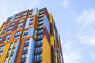 Modern building angle and windows. Multistory new multicolored apartment building. Stylish living