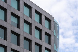 Madrid, Spain, October 16, 2021: Stone and glas ventilated facade of modern office building. Maria