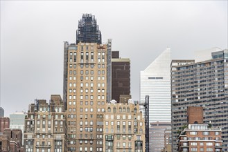 Apartment buildings in Upper East Side of New York City. Foggy Day in Manhattan. Cityscape of the