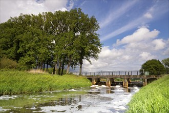 Weir in the river Aa close to Heeswijk castle in the Dutch village Heeswijk-Dinther