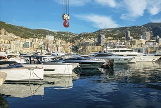 Awe Morning view on boats and yachts (sailboats) in Hercule port and buildings of Monaco in