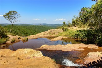 River with calm, transparent waters among the rocks, mountains and vegetation of the Muaimii