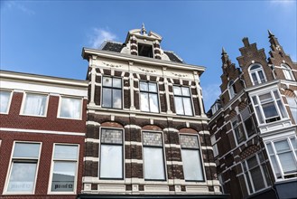 Haarlem, Netherlands, May 07, 2022: Low angle view of traditional Dutch houses in historic centre