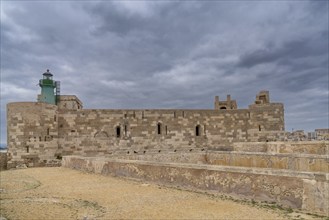 Syracuse, Italy, 28 December, 2023: view of the Maniace Castle and lighthouse in Isola di Ortigia