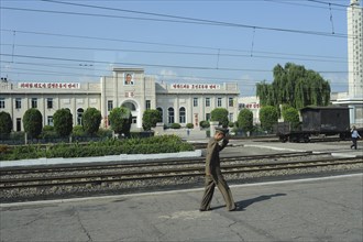 07.08.2012, Democratic People's Republic of Korea, Asia, A soldier walks along a railway platform