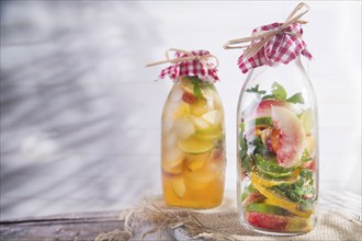 Bottle of infused fruit tea with peach and lemon