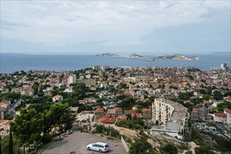 Aerial view om Marseille city: in distance small island of Chateau d'If, ??? left corner small