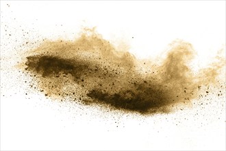 Stopping the movement of brown powder. Explosive brown powder on white background