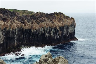 Cliffs in the north coast of Terceira Island, Azores, Portugal. CLoudy day of summer