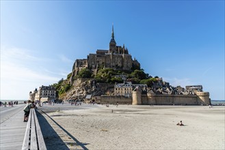 Mont Saint Michel, France, July 25, 2018: View of Mont Saint-Michel from boardwalk against sky,