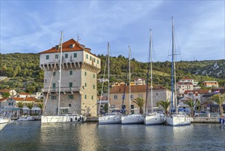 Quadrangular tower in port of Marina town, Croatia, Europe