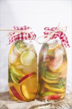 Bottle of infused fruit tea with peach and lemon