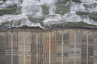 Aerial view of Versilia beach with rough sea photographed from above