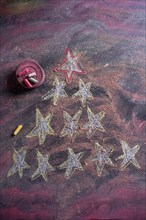 Small stylized christmas tree on blackboard with chalk