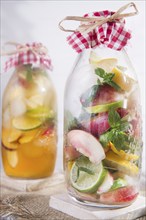 Bottle of infused fruit tea with peach and lemon