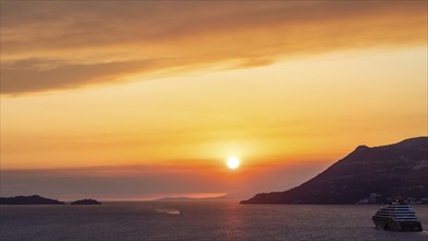 Cloudy atmosphere at sunset by the sea, view from the bell tower, cruise ship near Korcula, Korcula