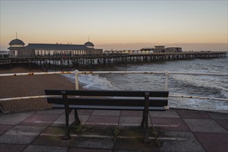 Hastings, East Sussex, England, UK, May 11, 2022: Evening mood on the beach, with a bench