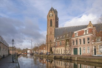 View on the St. Michael church in the Dutch historical town Oudewater along the river Hollandsche