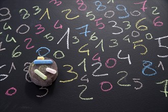 Graphic representation with chalk on blackboard with colorful numbers