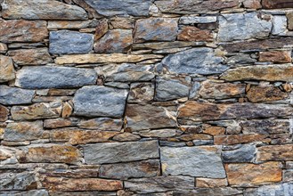 Slate slabs texture background. Pattern of black slate wall